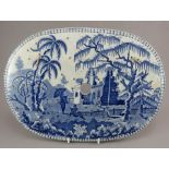 An early nineteenth century blue and white transfer-printed drainer, c.1810-15. It is decorated with