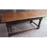 An early 18th century style refectory table with slender turned box frame base and single frieze