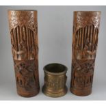 A pair of late 19th century Chinese hook carved bamboo sleeve vase with wooded oriental