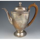 A late 18th century style heavy, silver pedestal coffee pot. With pearwood handle and spreading