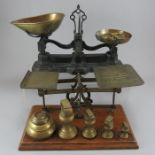 Two sets of early twentieth century scales, c.1910-30. To include a set of shop scales with brass
