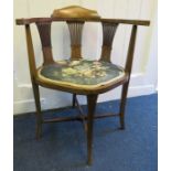 An Edwardian marquetry inlaid corner armchair with stuff over 58cm wide seat Provenance: From The