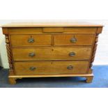 A Victorian mahogany low chest of two short over two long drawers with flanking twisted pilasters.