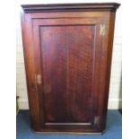 A George III parquetry single door oak hanging corner cupboard with 'H' hinges. 80cm wide