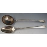 A Geo III "Old English" pattern silver basting spoon bearing a monogram. (2) Stretched halmarks