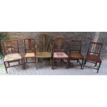 A pair of country made George III oak side chairs with reeded lath backs. Together with four other