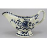 A late eighteenth century hand-painted blue and white pearlware sauce boat, c. 1790-1800. It has