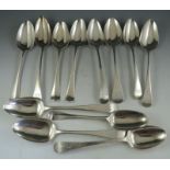 A composite set of mostly 19th century, English silver, soup spoons of various design, date and