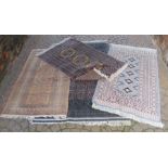 A Pakistani Multan type rug of plain ground. Together with three other similar rugs (4)
