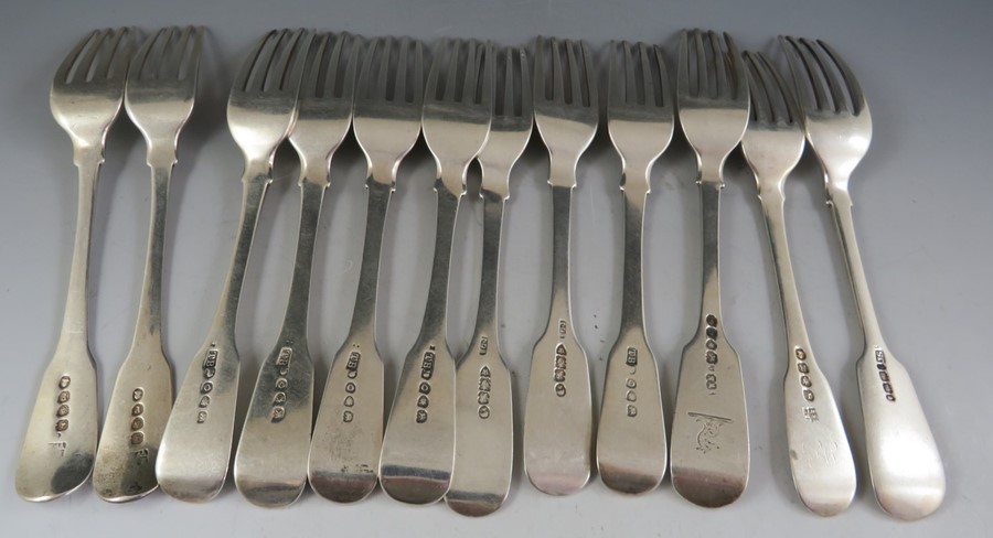 A matching but composite set of twelve, 19th century "fiddle pattern" silver desert forks, some - Image 3 of 3