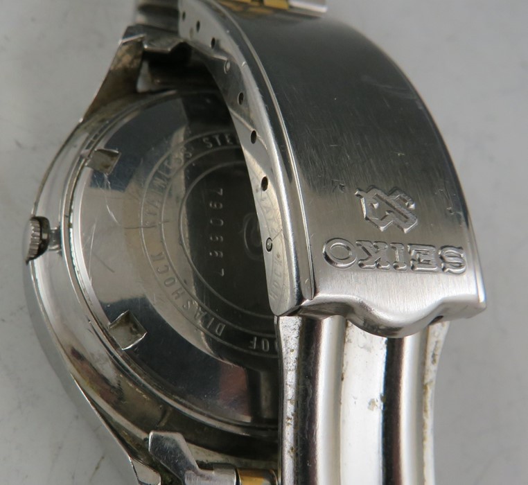 A vintage Seiko 5 sportsmatic with stainless case and two tone bracelet. The day date dial with - Image 2 of 2