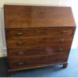 A George III satinwood strung mahogany fall front writing bureau with fitted interior above four low