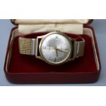 A 9ct gold Garrads of London gents automatic wristwatch with calendar aperture