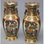A pair of late 20th century Oriental vases of baluster form, each with wavy rim, dragon handles,