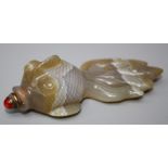 A Chinese carved banded agate snuff bottle fashioned as a long tail fish with coral coloured stone