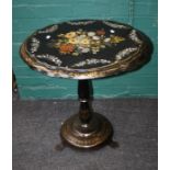 A Victorian papier mache tilt top table with florally painted and mother of pearl decoration. 67
