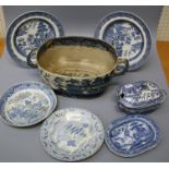A large collection of mostly "Willow" pattern blue and white transfer printed pottery plates and