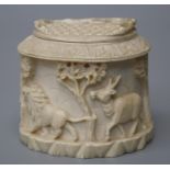 An early 20th century  ivory box and cover, carved in relief with savannah and jungle animals. 8 x 8