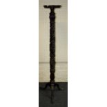 A Geo III carved mahogany torcher with turned dish top and tripod base (former bedpost) 157 cm high