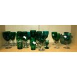 A collection of Victorian/Edwardian (Bristol) emerald green bowled wine glasses with clear stems and