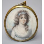 An early to mid 19th century three quarter, oval portrait miniature on ivory of a lady in the manner