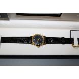 A gift boxed Raymond Weil of Geneva 18ct gold plated manual winf ladies watch with stone set black