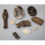 A collection of Egyptian artefacts scarabs and petrified wood