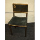 A Geo VI limed oak and green velvet coronation chair. The back with Royal cypher of GeoVI.