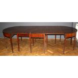 A Geo. III mahogany dining table, the central section with two drop leaves each with single gate,