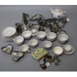 An early 20th century Continental doll's part tea set decorated with forget-me-nots, a beaded