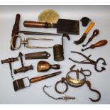 A collection of vintage and antique kitchenalia to include measures, graters, horn spoons, fleece "