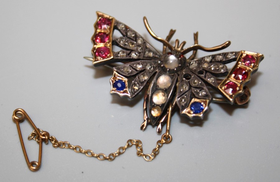 A Victorian gemset Butterfly brooch/pendant. 2 x rose cut diamonds missing