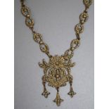 A Continental silver gilt seed pearl necklace with floral pendant drop