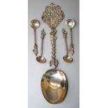 An early 20th century Dutch cast silver cabinet spoon (re-assayed) Together with a set of four