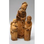 A Chinese carved bamboo figure of Shouxing, together with Hotei and one other figure. 16 to 29 cms.