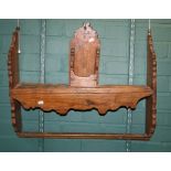 An 18th century provincial softwood wall hanging spoon rack, with shaped outline and provision for