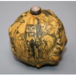 A Chinese gourd snuff bottle, decorated with a scholar and children, pale amethyst coloured