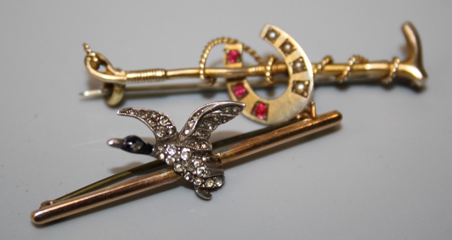 A Victorian Horseshoe and Riding crop brooch and a brooch with Mallard in flight, set paste (2)