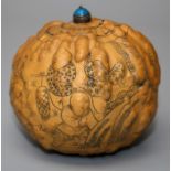 A large Chinese gourd snuff bottle, decorated with figures, blue stone stopper. 8 cms.