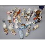 A large collection of 19th and 20th century pottery and porcelain novellty  boots and shoes.