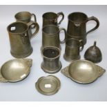 A collection of mostly 19th and 20th century pewter measures and tankards including a Victorian