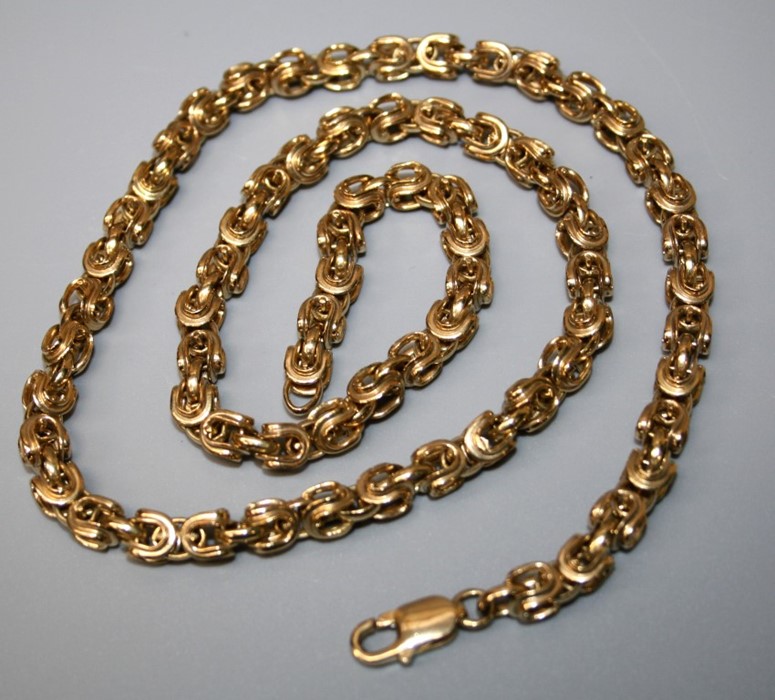 A 9ct gold fancy link longchain of heavy hooped links. 60cm long 72.6g