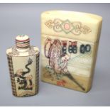 An Oriental vegetable ivory card case decorated with figures in landscapes. 10 x 8 cms. together