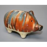 A Rye Pottery type piggy bank with combed glaze decoration 7 x 10 cms.