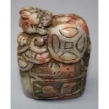 A Chinese jade coloured stone seal carved with kylin and coins. 8cms.