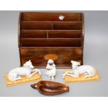 An Edwardian rosewood letter rack together with a pair of Staffordshire type recumbent long dog