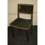 A Geo VI limed oak and green velvet coronation chair. The back with Royal cypher of GeoVI.