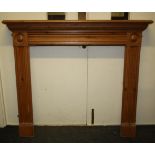 A Regency style chimney piece with roundels and moulded decoration.135cm wide