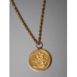 A 9ct Pendant set sovereign dated 1888, suspended on 9ct Prince of Wales twist chain