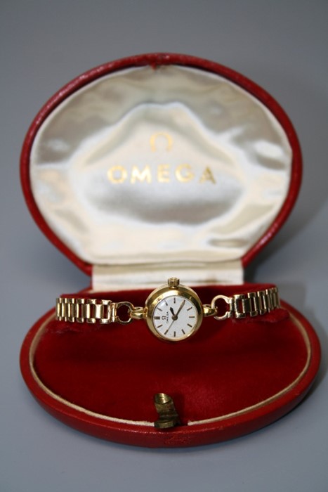 A ladys 18ct gold Omega wristwatch, the circular dial with baton numerals, circular lugs and open